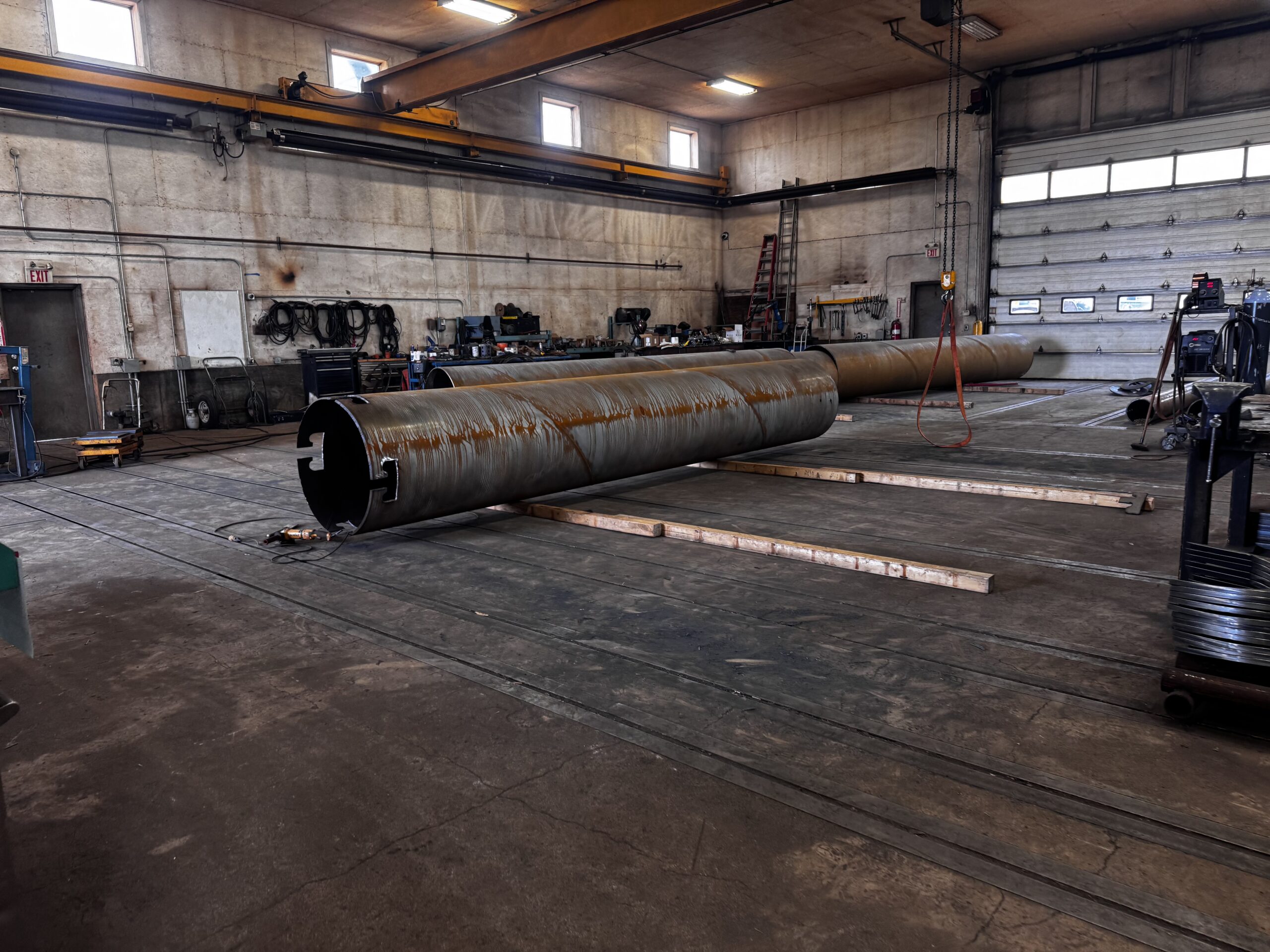 True Pitch screw piles being fabricated inside the Inland Screw Piling facility in Coaldale, Alberta